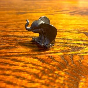 Vintage miniature pewter sitting elephant figurine. Collectible
